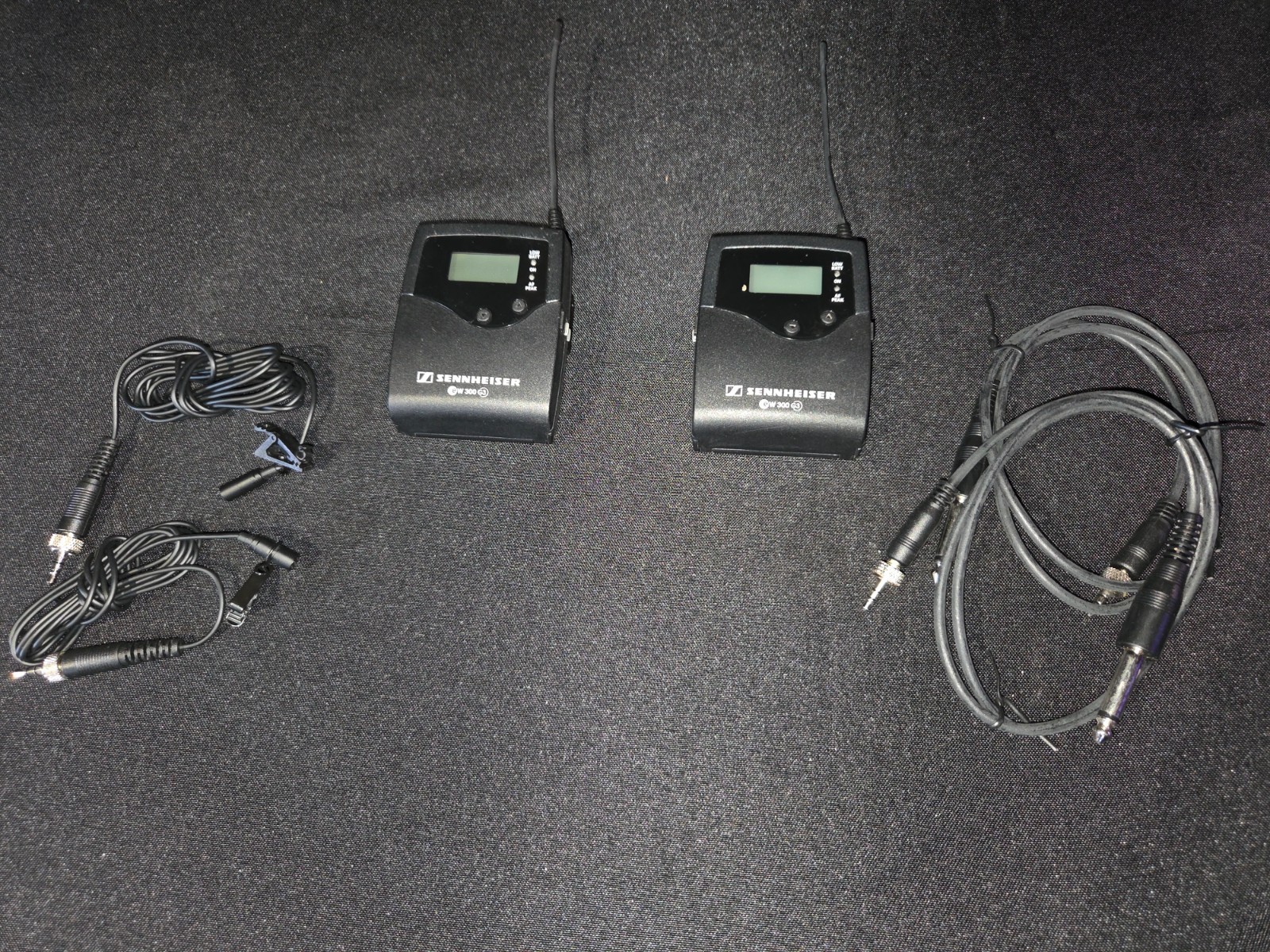Sennheiser EW 300 Bodypack Pair + Lapels + 1/4″ Adapters ( 566-608 MHz) in case